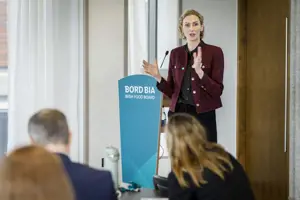 Woman presenting at a podium