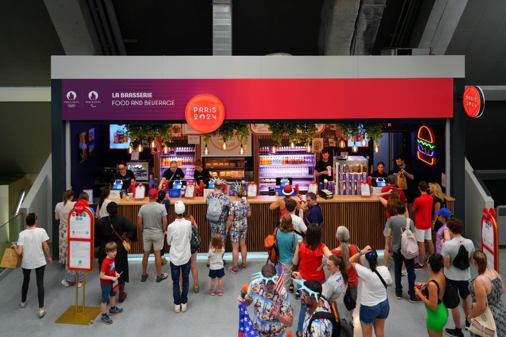 People queuing at a restaurant at the Paris Olympics.