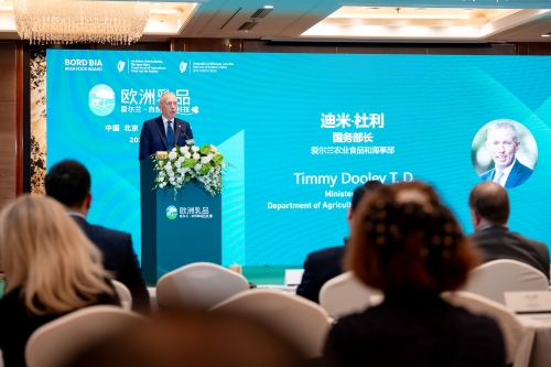 Man standing speaking at podium, Bord Bia green background