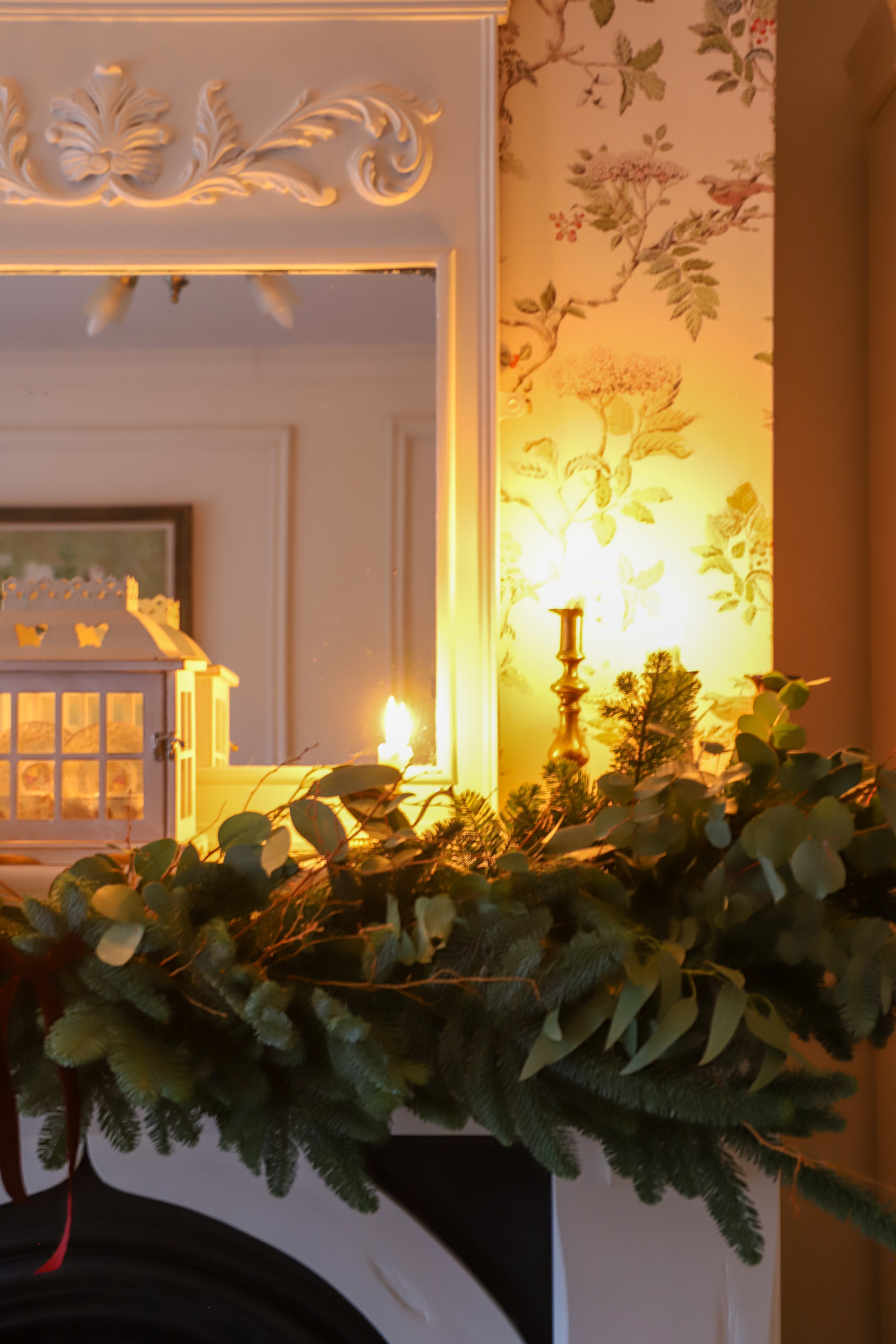 Candle and garland on mantlpiece