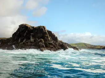 Rocky outcrop surrounded by choppy waters