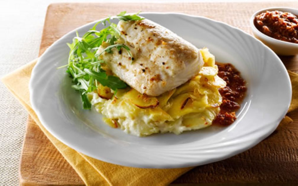 Grilled Hake with Garlic Potatoes and Sun-Dried Tomato Dressing