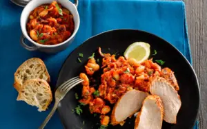 Pork Steak Roasted with Tomatoes, Red Onion and Beans