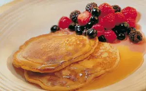 Warm Pancakes with Berries and Maple Syrup