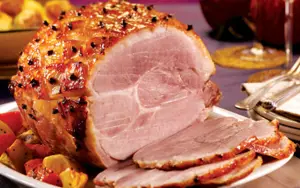 Sliced Christmas ham on plate